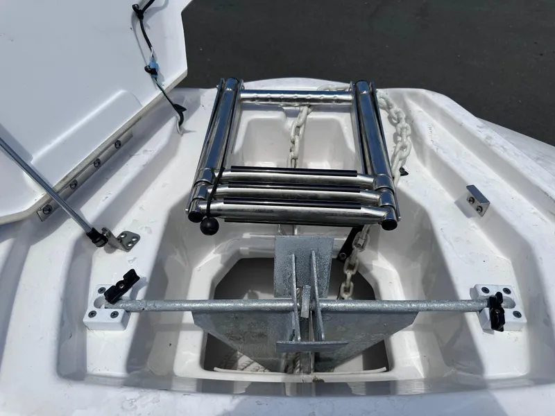 Slide: The Image of Anchor storage compartment of 2021 Yamaha Boats 252 SD with stainless steel ladder. - 40