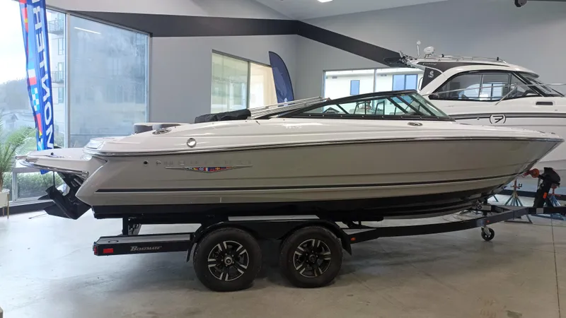Slide: The Image of 2025 Monterey 224FS boat on trailer in showroom. - 10