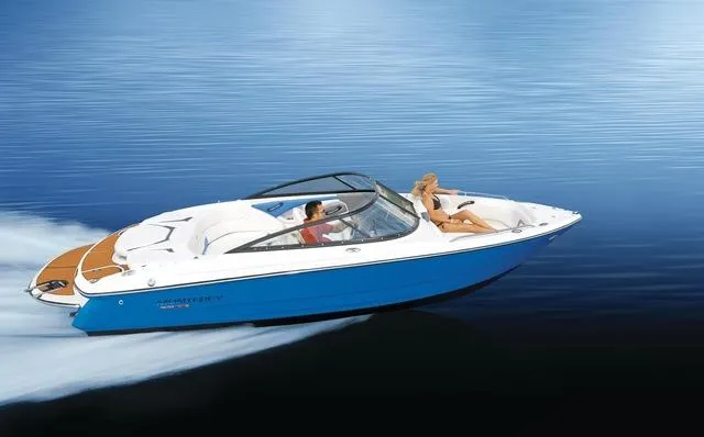 Slide: The Image of 2025 Monterey 224FS speedboat cruising on calm blue water. - 14