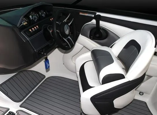 Slide: The Image of 2025 Monterey 224FS boat interior with steering wheel and captain's chair. - 18