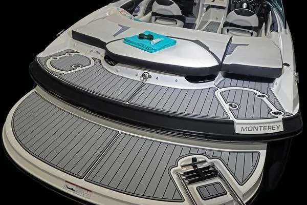 Slide: The Image of 2025 Monterey 224FS boat with spacious deck and seating area. - 21