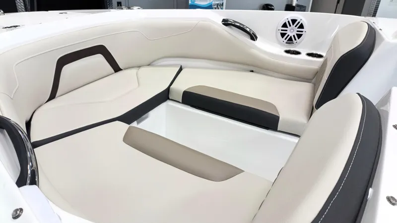 Slide: The Image of 2025 Monterey 224FS boat interior with beige and black seating. - 3
