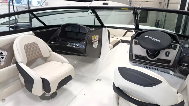 Slide: The Image of 2025 Monterey 224FS boat interior with modern seating and steering console. - 4