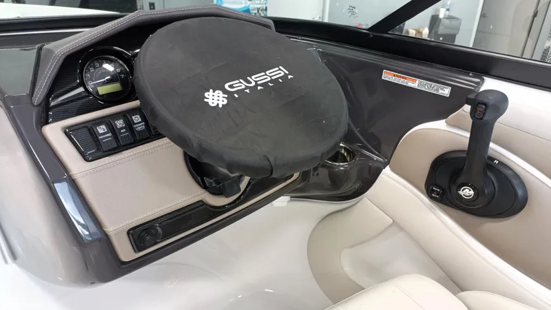 Slide: The Image of 2025 Monterey 224FS boat dashboard with Gussi Italia steering wheel cover. - 5