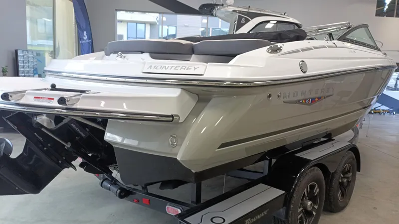 Slide: The Image of 2025 Monterey 224FS boat on trailer in showroom. - 8