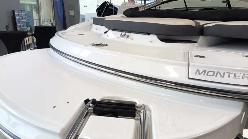 Slide: The Image of 2025 Monterey 224FS boat interior with cushioned seating and sleek design. - 9