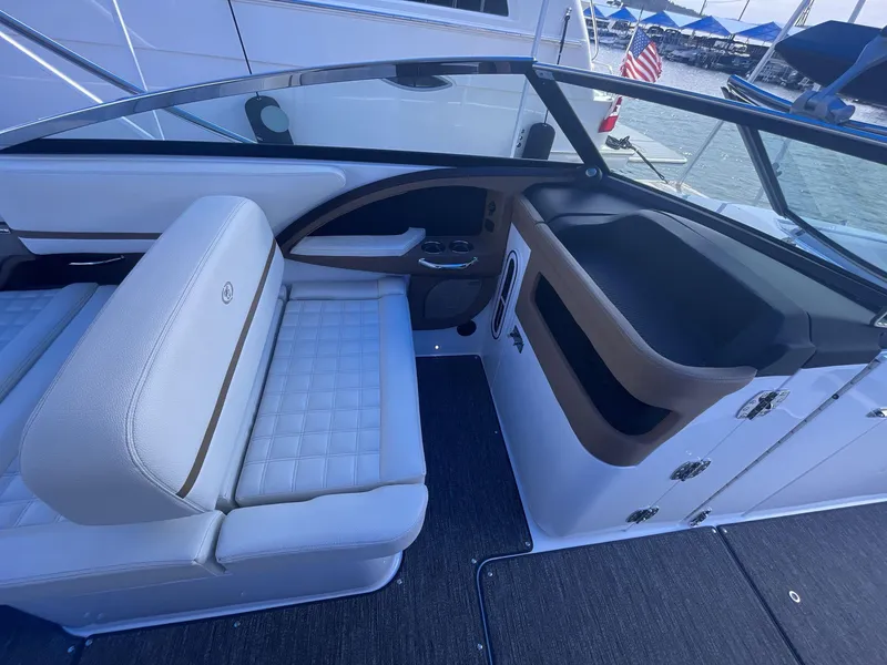 Slide: The Image of 2021 Cobalt R30 boat interior with white seating and sleek design. - 11