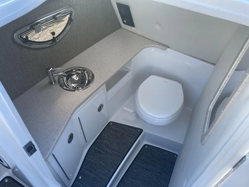 Slide: The Image of 2021 Cobalt R30 boat interior bathroom with sink and toilet. - 12