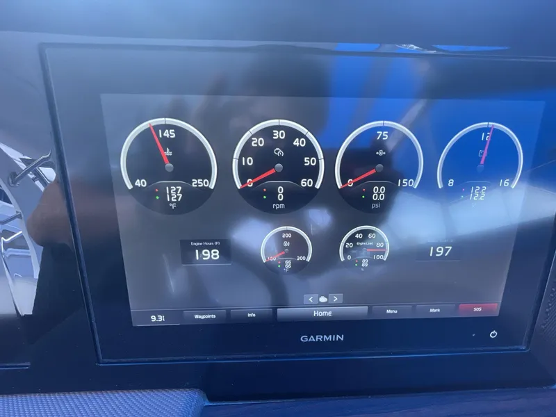 Slide: The Image of Garmin display showing gauges on a 2021 Cobalt R30 boat dashboard. - 14
