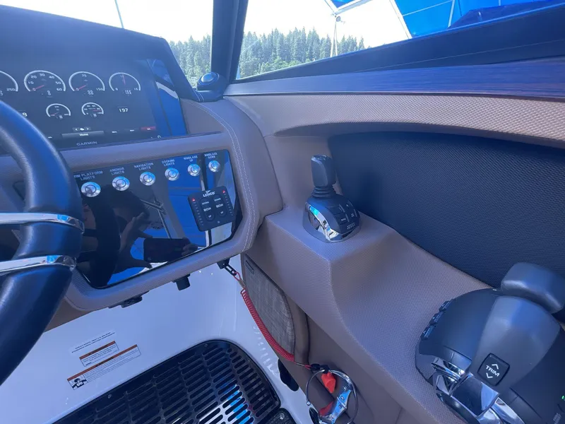 Slide: The Image of Dashboard of a 2021 Cobalt R30 boat with control panel and steering wheel. - 15
