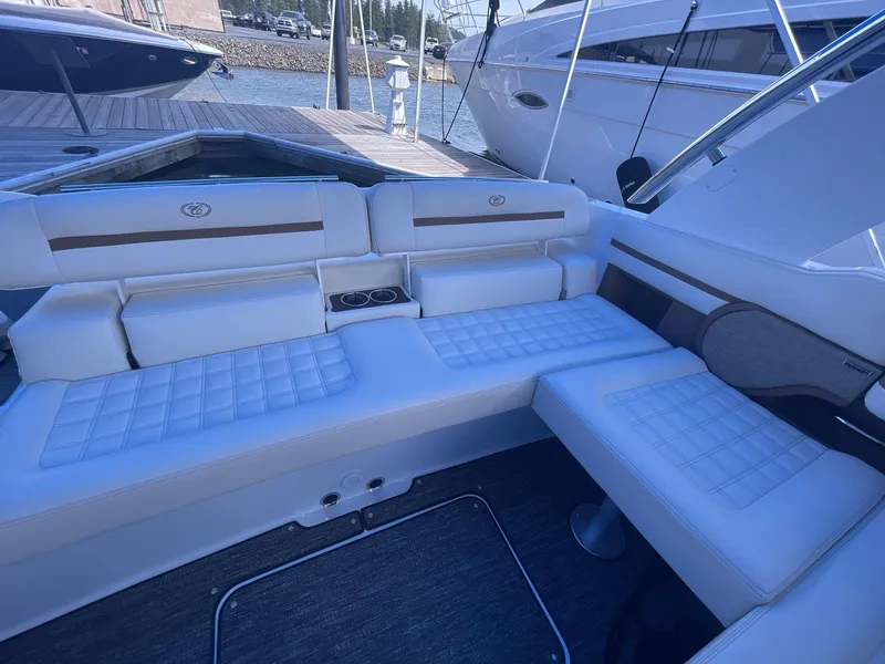 Slide: The Image of Luxurious seating area on a 2021 Cobalt R30 boat, docked at a marina. - 17