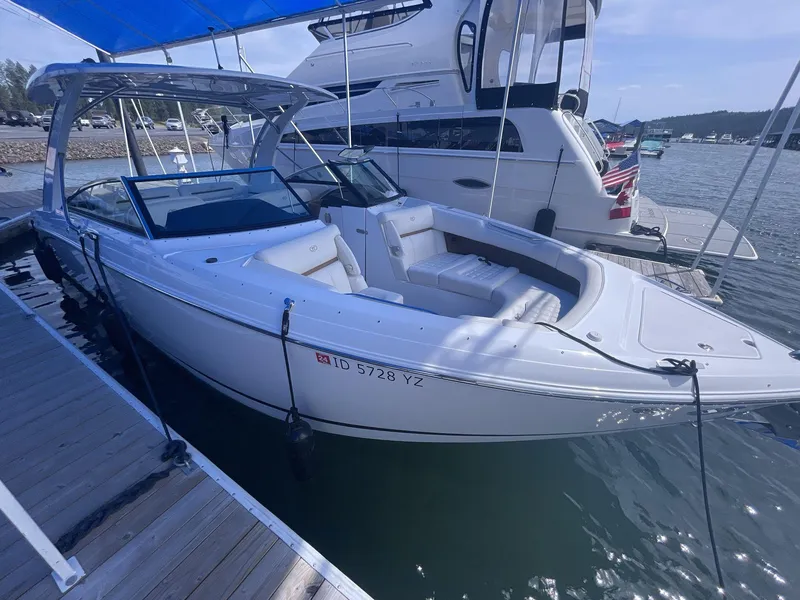 Slide: The Image of 2021 Cobalt R30 boat docked at marina, featuring sleek design and spacious seating. - 6
