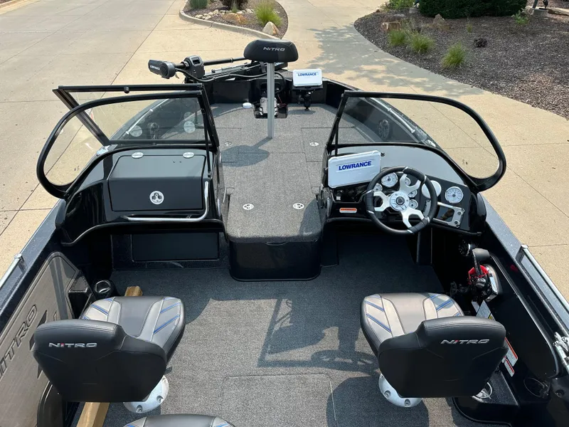 Slide: The Image of 2024 Nitro ZV19 Sport Pro boat interior with steering console and seating. - 6
