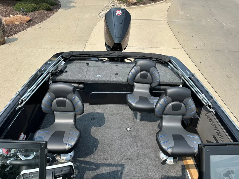 Slide: The Image of 2024 Nitro ZV19 Sport Pro boat interior with four seats and motor. - 7