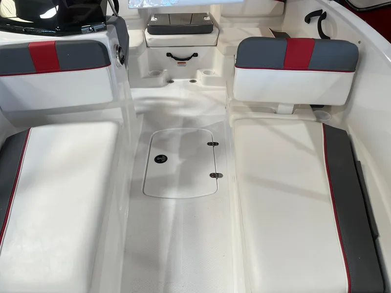 Slide: The Image of 2024 Tahoe T16 boat interior with white and gray seating, red accents, and storage compartments. - 7