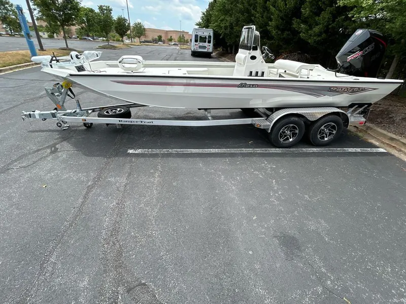 Slide: The Image of 2024 Ranger RB210 boat on trailer in parking lot, side view. - 3