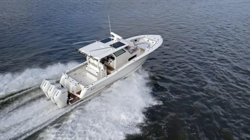 The Image of 2025 Scout 357 LXF boat cruising on open water. - 0
