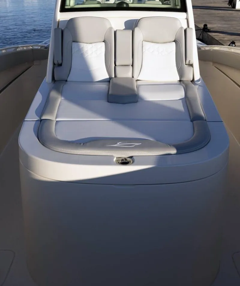 Slide: The Image of 2025 Scout 357 LXF boat with luxurious seating and sleek design. - 10