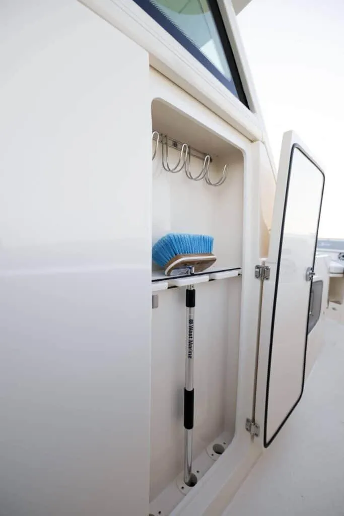 Slide: The Image of Storage compartment on the 2025 Scout 357 LXF boat. - 13