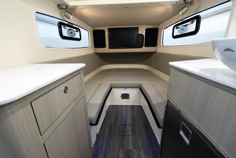 Slide: The Image of Interior cabin of 2025 Scout 357 LXF boat with modern amenities and sleek design. - 16