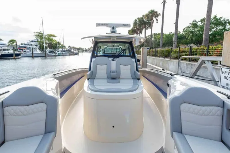 Slide: The Image of 2025 Scout 377 LXF luxury boat interior at marina. - 13