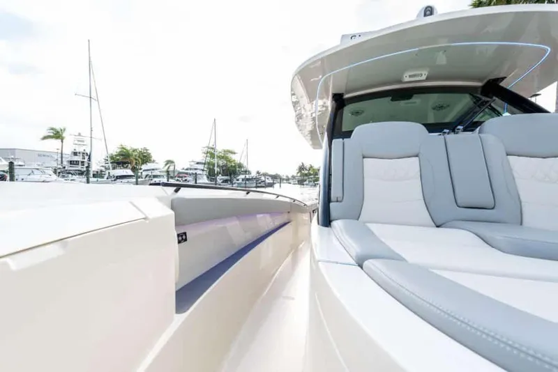 Slide: The Image of 2025 Scout 377 LXF luxury boat interior with plush seating and modern design. - 14