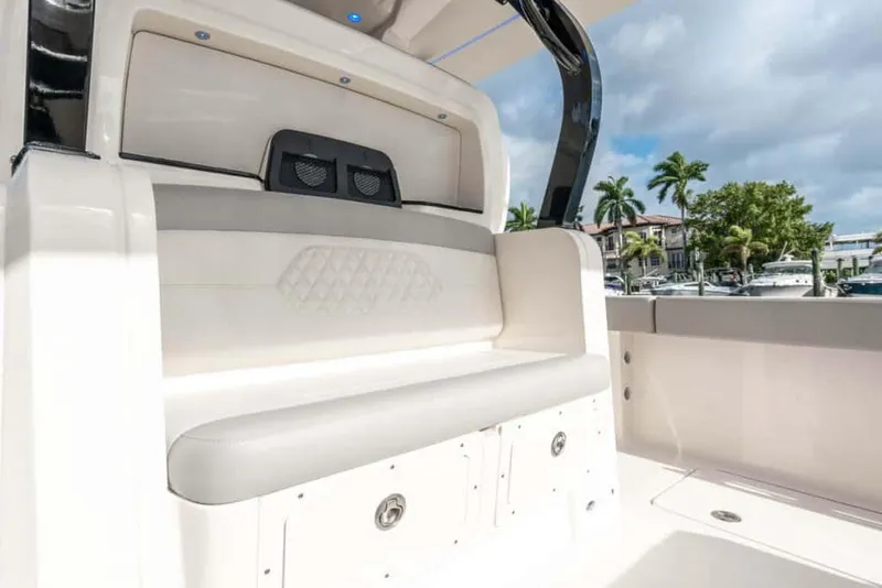 Slide: The Image of 2025 Scout 377 LXF boat interior seating with storage compartments. - 15