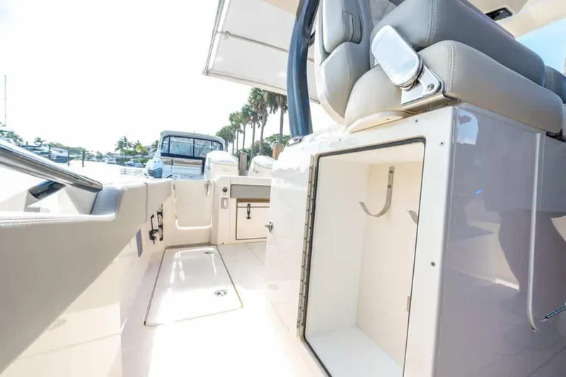 Slide: The Image of 2025 Scout 377 LXF boat interior with open storage compartment. - 9