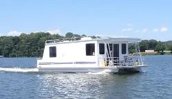 The Image of 2013 Catamaran Cruisers 39 houseboat cruising on a lake. - 1