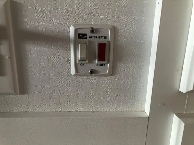 Slide: The Image of Water heater switch on a 2013 Catamaran Cruisers 39 boat. - 11