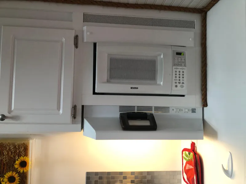 Slide: The Image of Microwave and range hood in Catamaran Cruisers 39, 2013 model kitchen. - 26