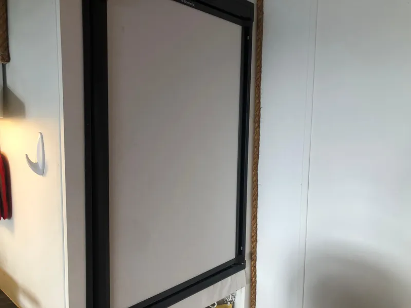 Slide: The Image of Interior of 2013 Catamaran Cruisers 39, featuring a framed panel on the wall. - 27