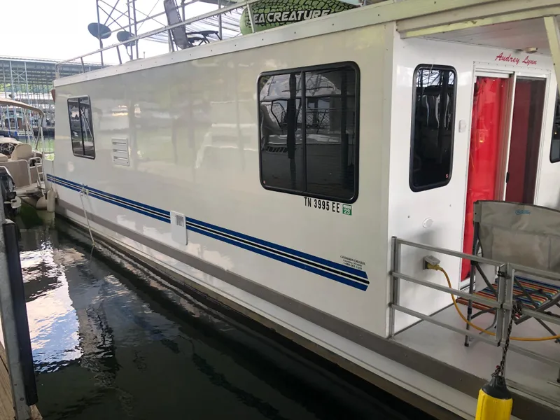 Slide: The Image of 2013 Catamaran Cruisers 39 houseboat docked in a marina. - 33