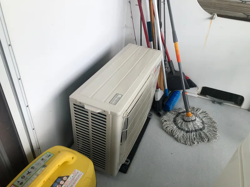 Slide: The Image of Air conditioning unit and cleaning supplies on a 2013 Catamaran Cruisers 39 boat. - 9