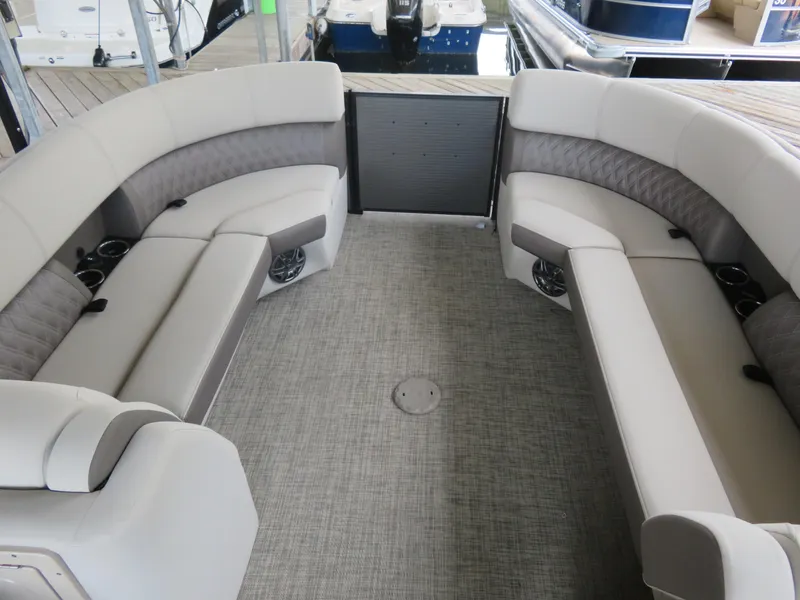 Slide: The Image of Luxurious seating area on 2023 Harris Sunliner 230 pontoon boat, featuring plush upholstery. - 4