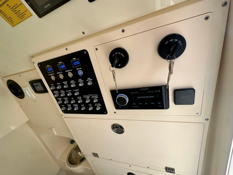 Slide: The Image of Control panel of 2025 Scout 330 LXF boat with gauges and switches. - 5