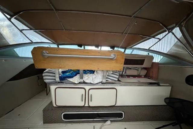 Slide: The Image of 1986 Sea Ray 340 Express Cruiser interior cabin with storage compartments. - 16
