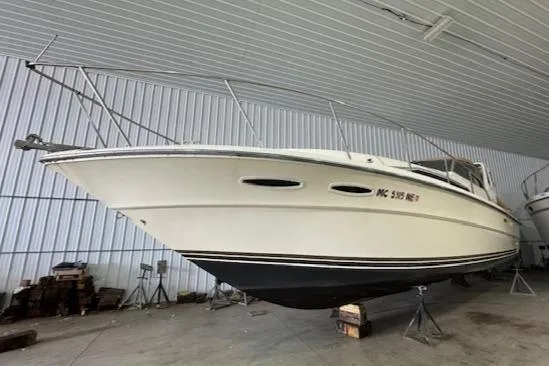 Slide: The Image of 1986 Sea Ray 340 Express Cruiser in storage, side view. - 4