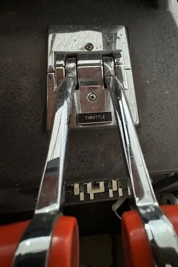 Slide: The Image of Throttle controls of a 1986 Sea Ray 340 Express Cruiser boat. - 9