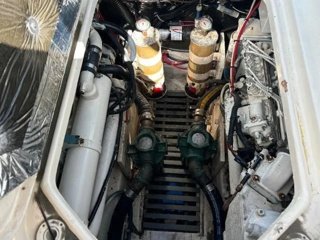 Slide: The Image of Engine compartment of a 1997 Tiara Yachts 3100 Open, showcasing mechanical components. - 20