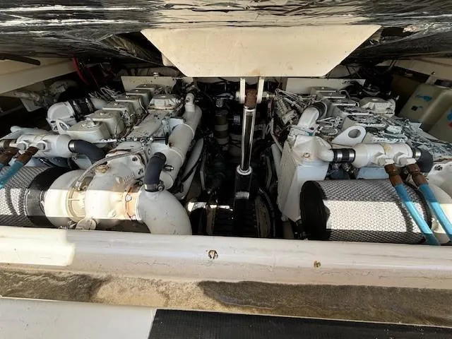Slide: The Image of Engine compartment of a 1997 Tiara Yachts 3100 Open, showcasing dual engines. - 22