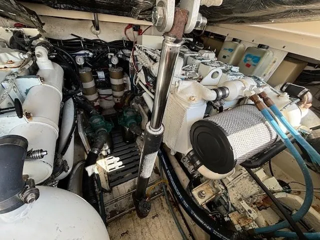Slide: The Image of Engine compartment of a 1997 Tiara Yachts 3100 Open, showcasing mechanical components and systems. - 23