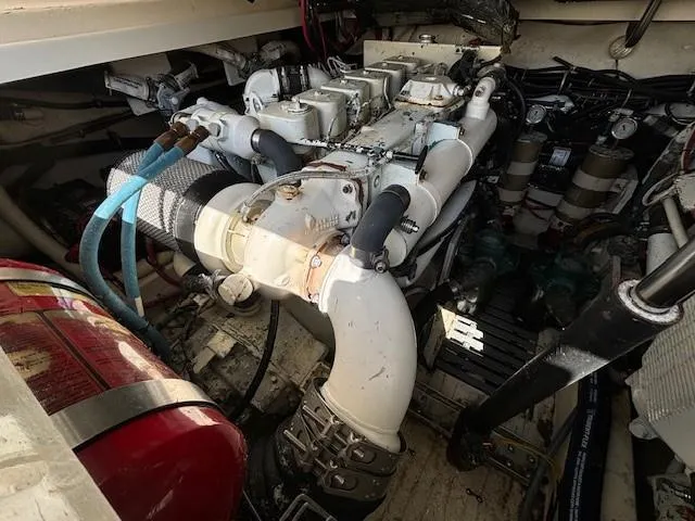 Slide: The Image of Engine compartment of a 1997 Tiara Yachts 3100 Open, showcasing mechanical components and systems. - 24