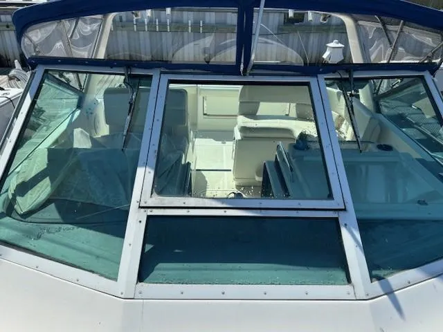 Slide: The Image of 1997 Tiara Yachts 3100 Open boat interior view with seating and windshield. - 4