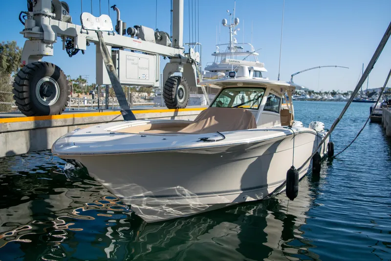 The Image of 2020 Scout 380 LXF boat docked at marina. - 0