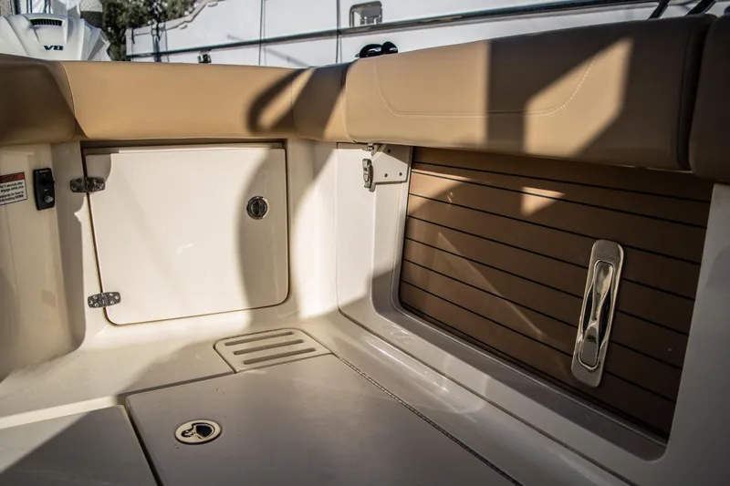 Slide: The Image of Interior seating and storage area of a 2020 Scout 380 LXF boat. - 13