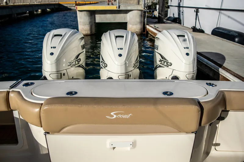 Slide: The Image of 2020 Scout 380 LXF boat with triple V8 engines docked. - 14