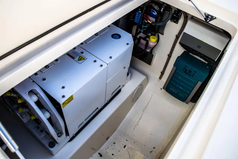 Slide: The Image of Engine compartment of a 2020 Scout 380 LXF boat with electrical components. - 16