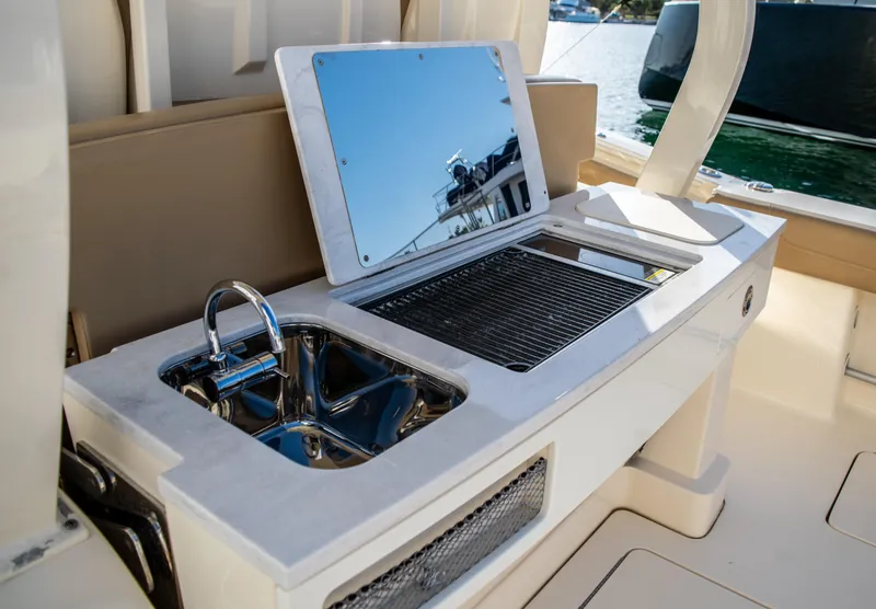 Slide: The Image of 2020 Scout 380 LXF boat with onboard sink and grill station. - 20