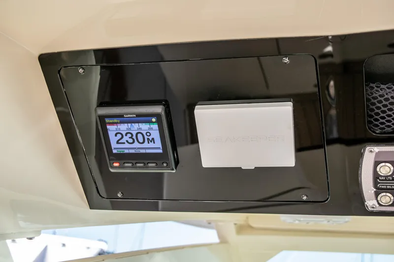 Slide: The Image of 2020 Scout 380 LXF boat dashboard with electronic display and controls. - 22